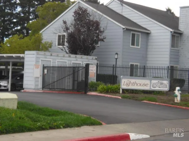 a view of a house with a garden and pathway