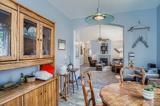 a living room with furniture a rug and a chandelier