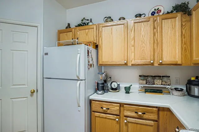 a white refrigerator freezer sitting in a kitchen