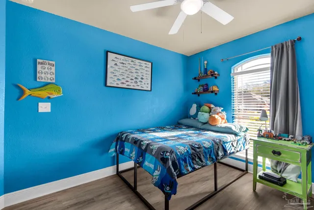 a bedroom with a bed and a table in it