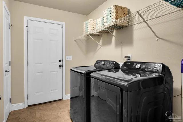 a kitchen that has a stove and a table