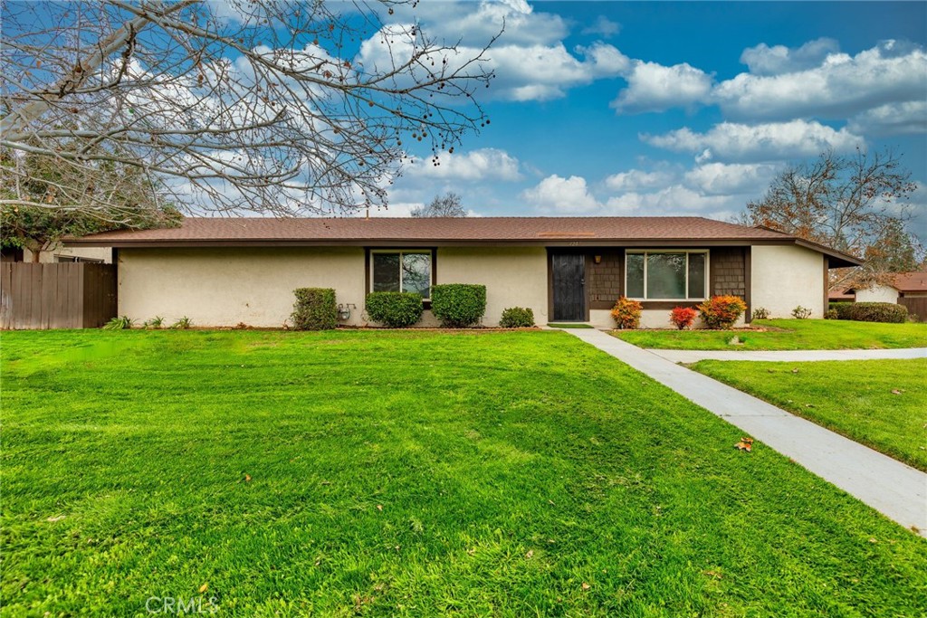 4207 Kingsbury Place Riverside, CA 92503 - Photo 1 of 1 a front view of house with garden