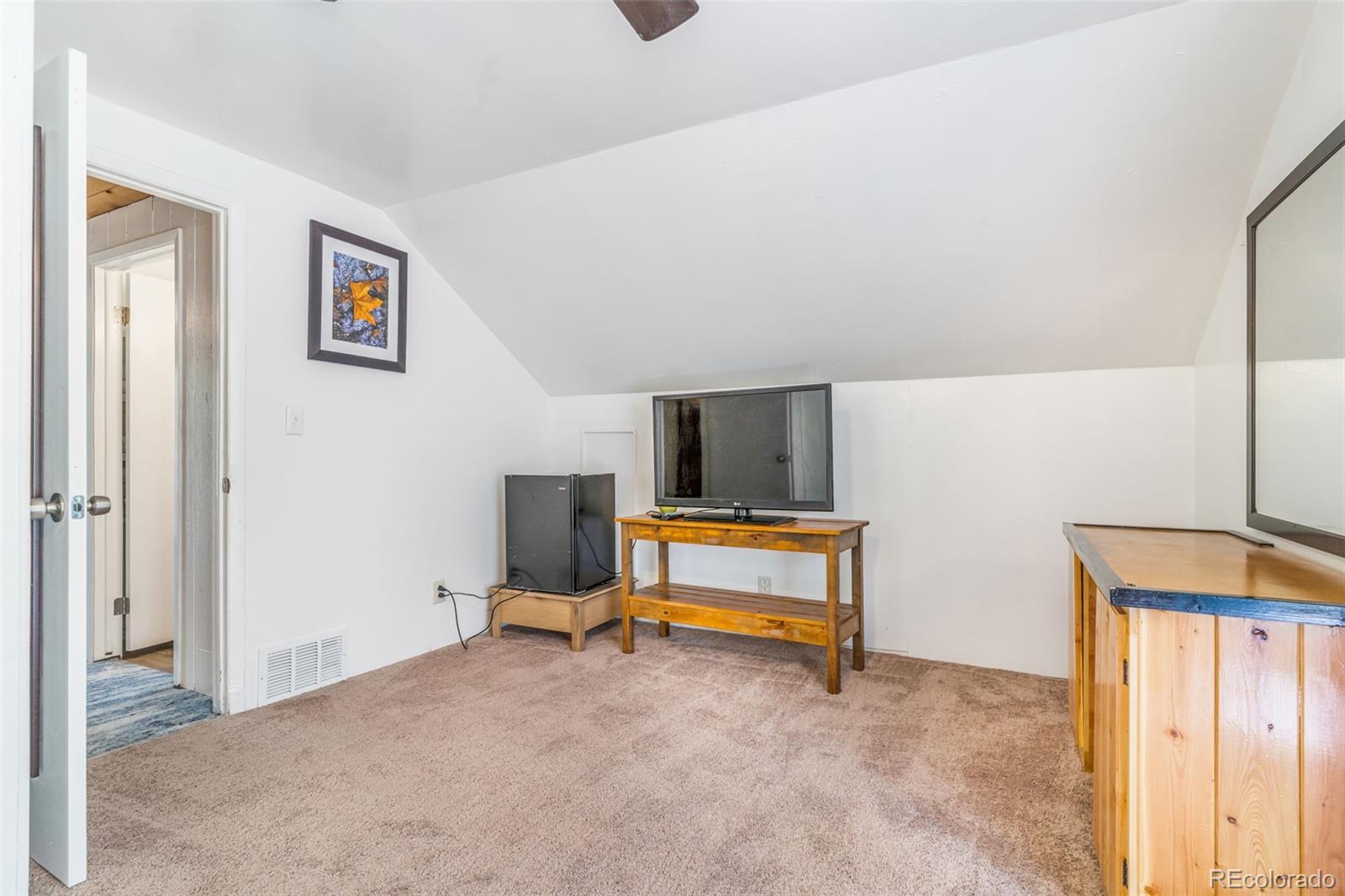 145 Bailey Drive Bailey, CO 80421 - Photo 14 of 21 a bedroom with furniture and window