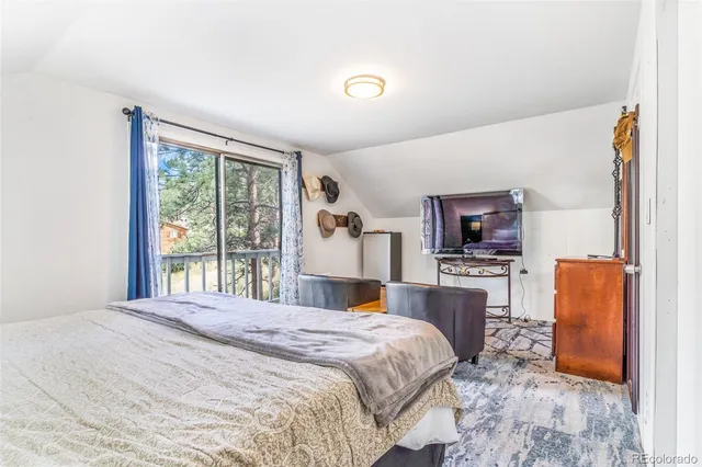 a view of a patio with table and chairs and wooden floor