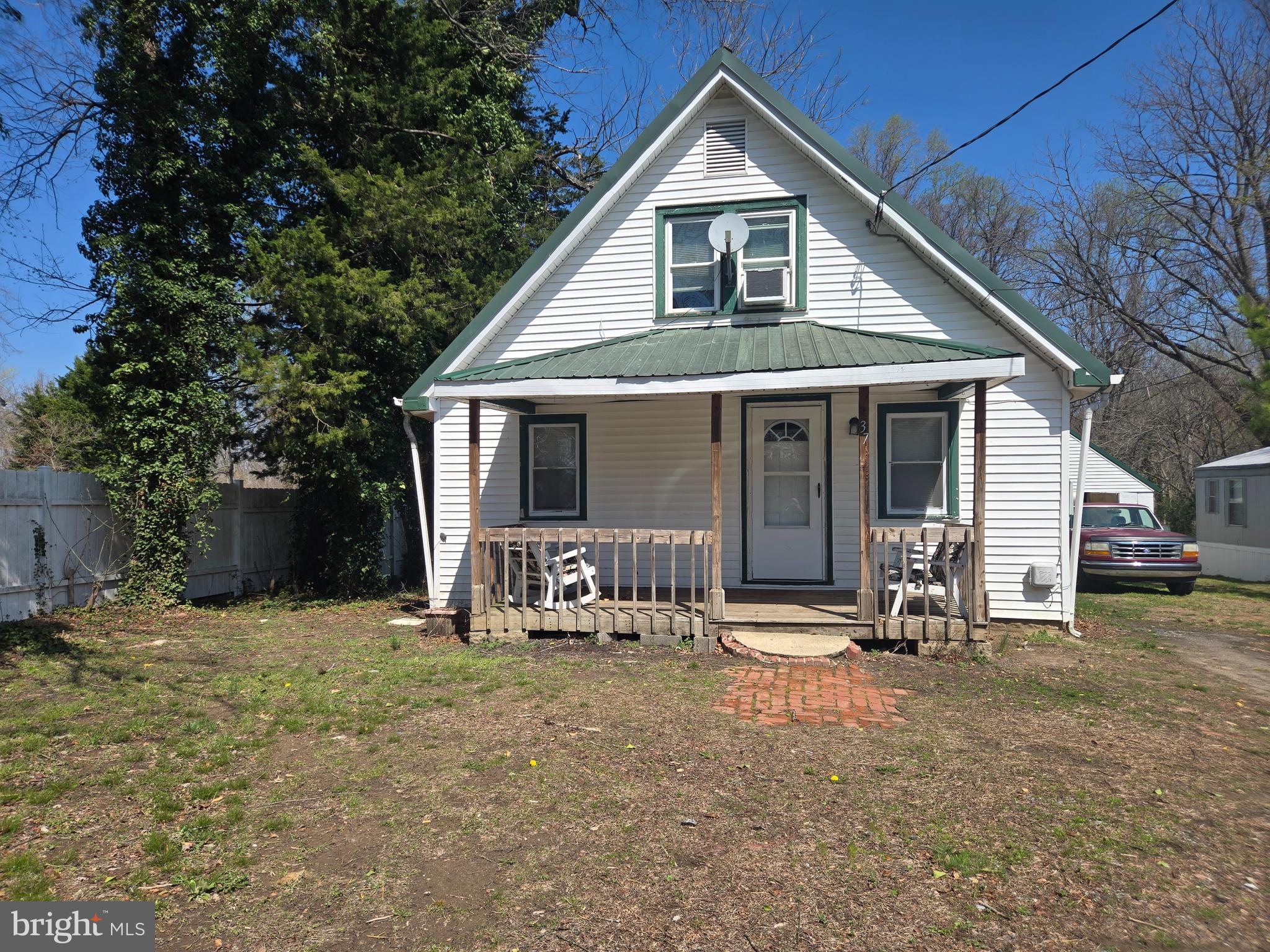 37 Asbury Avenue Dover, DE 19901 - Photo 1 of 16 a front view of house with outdoor seating