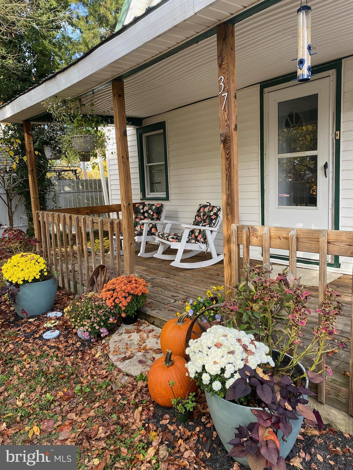 37 Asbury Avenue Dover, DE 19901 - Photo 2 of 16 a view of a balcony with chairs and potted plants
