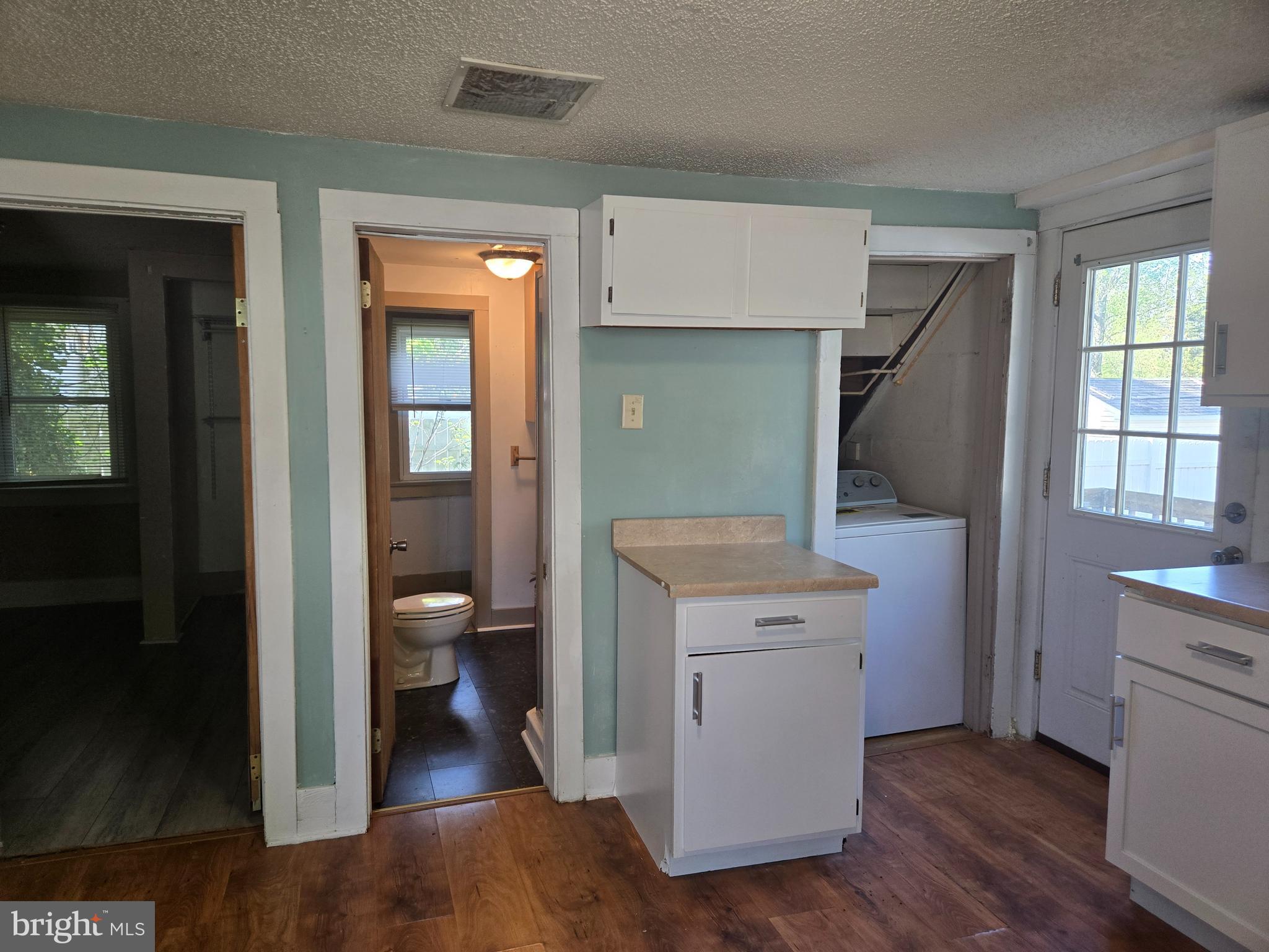 37 Asbury Avenue Dover, DE 19901 - Photo 4 of 16 a view of bathroom with a toilet sink and a mirror