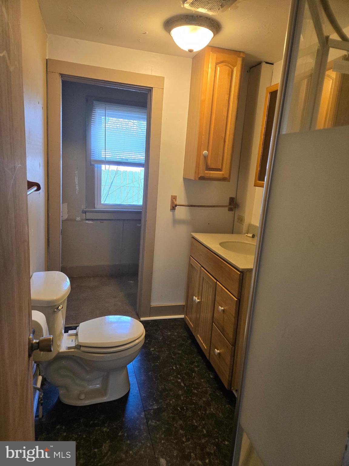 37 Asbury Avenue Dover, DE 19901 - Photo 9 of 16 a bathroom with a sink and a toilet