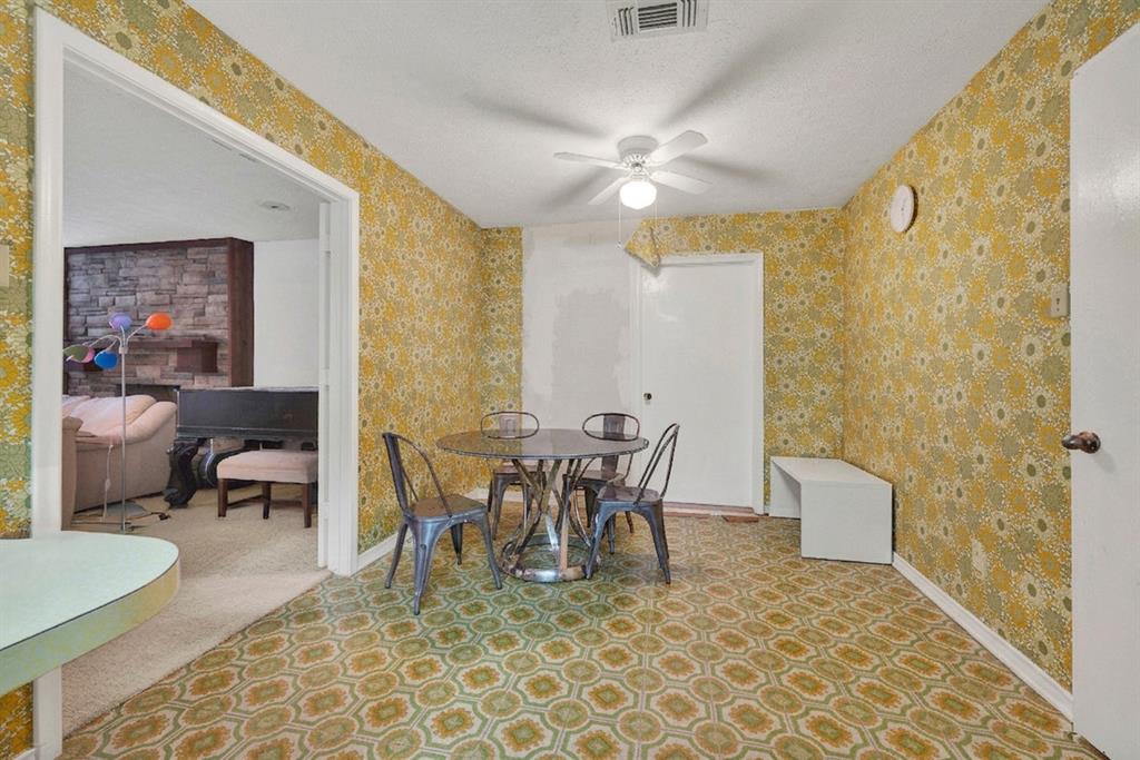 1415 South Joe Wilson Road Cedar Hill, TX 75104 - Photo 13 of 17 a view of a dining room with furniture and chandelier