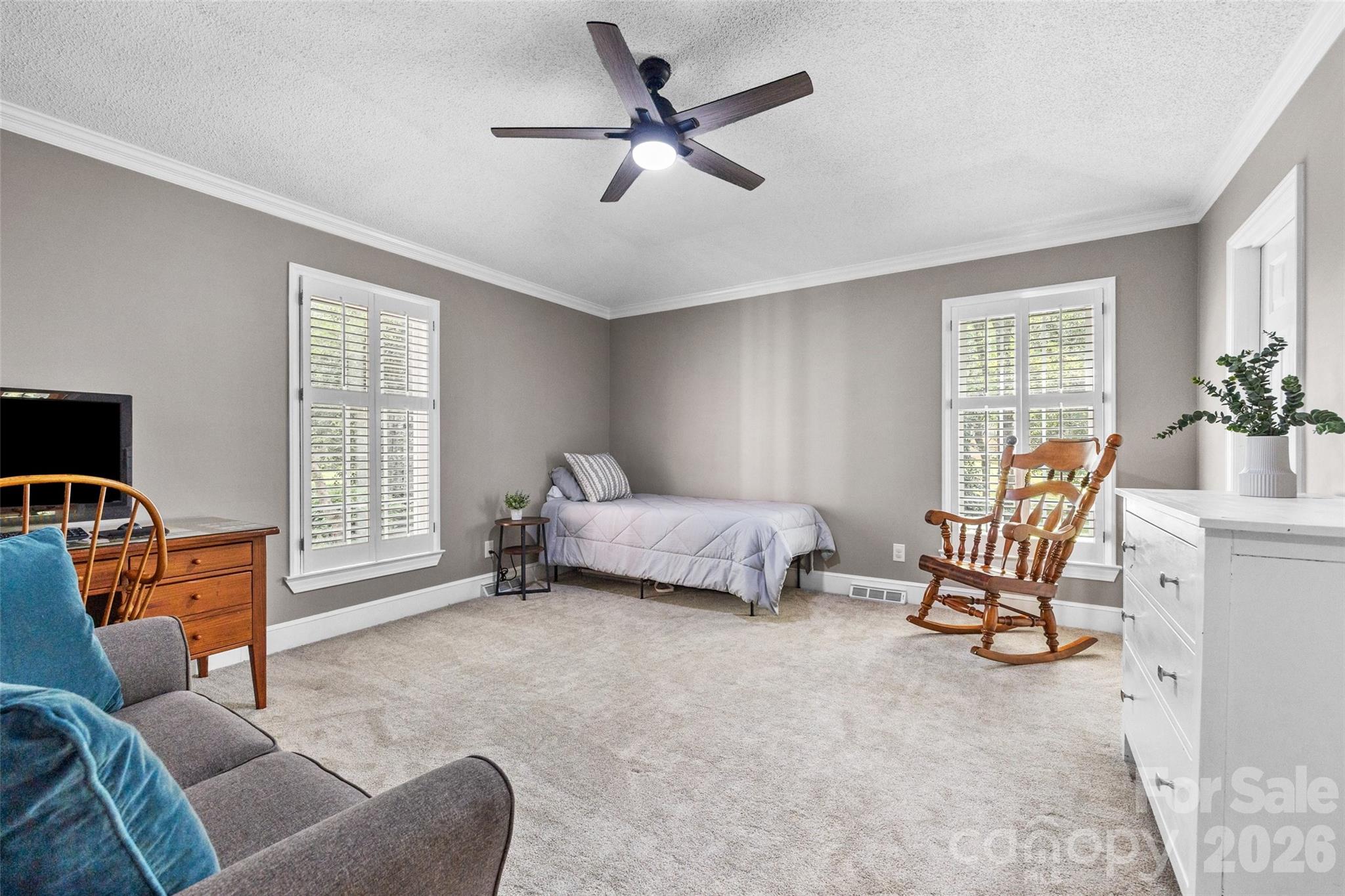 10500 Doylestown Road Matthews, NC 28105 - Photo 19 of 46 a bedroom with furniture and windows