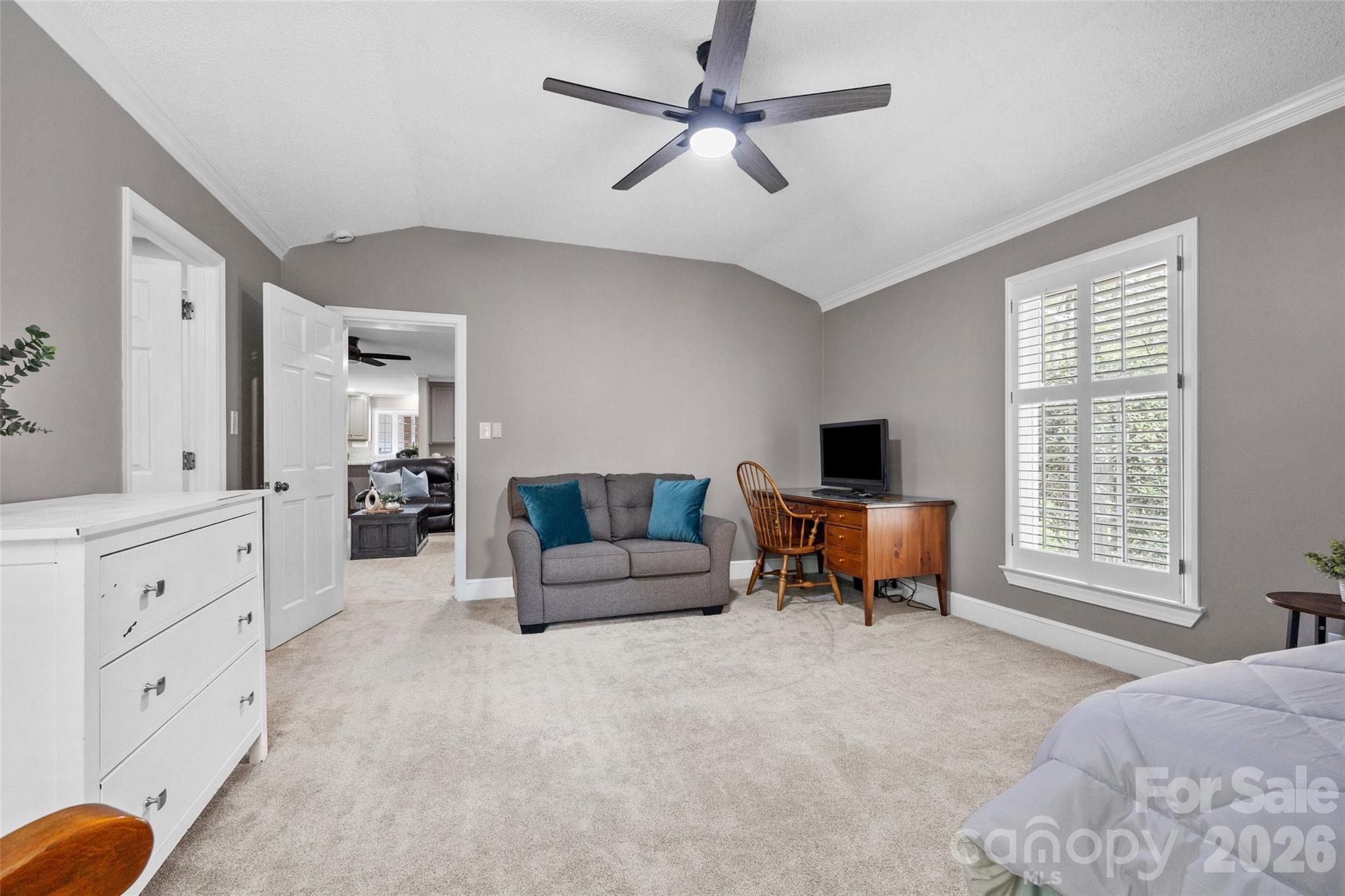 10500 Doylestown Road Matthews, NC 28105 - Photo 20 of 46 a spacious bedroom with a bed and a couch