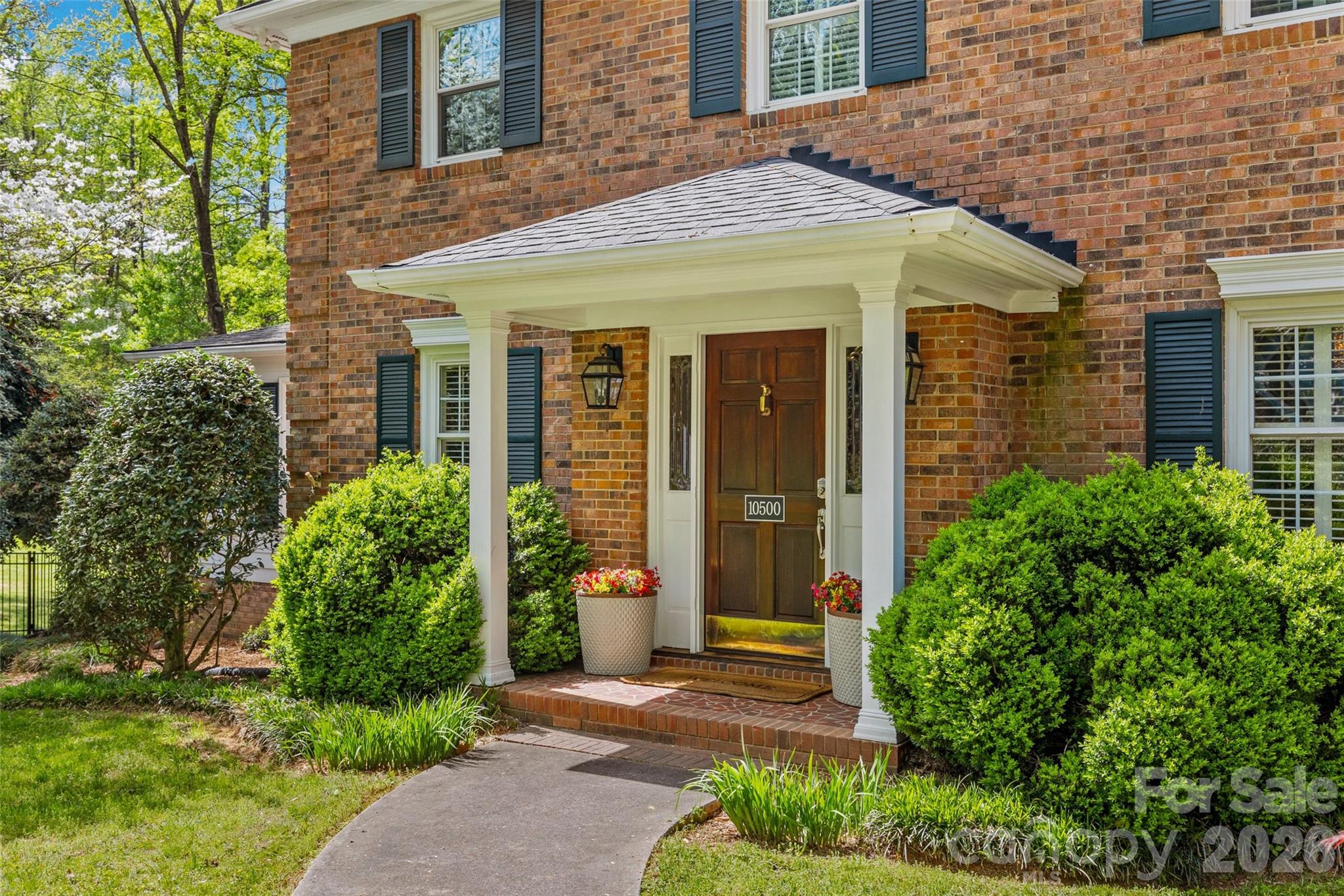 10500 Doylestown Road Matthews, NC 28105 - Photo 2 of 46 front view of a house with a yard