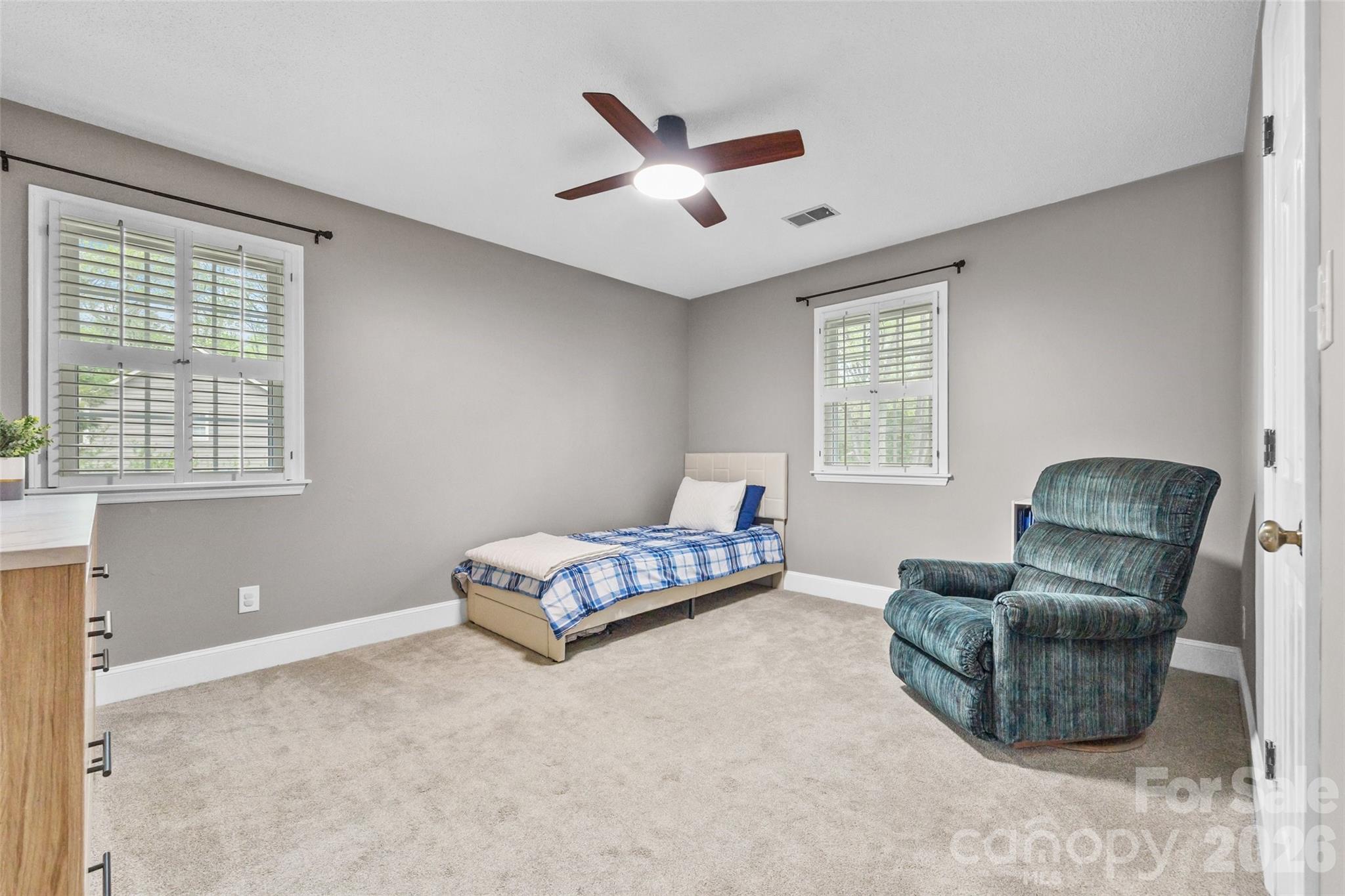 10500 Doylestown Road Matthews, NC 28105 - Photo 24 of 46 a living room with furniture gym equipment and a window