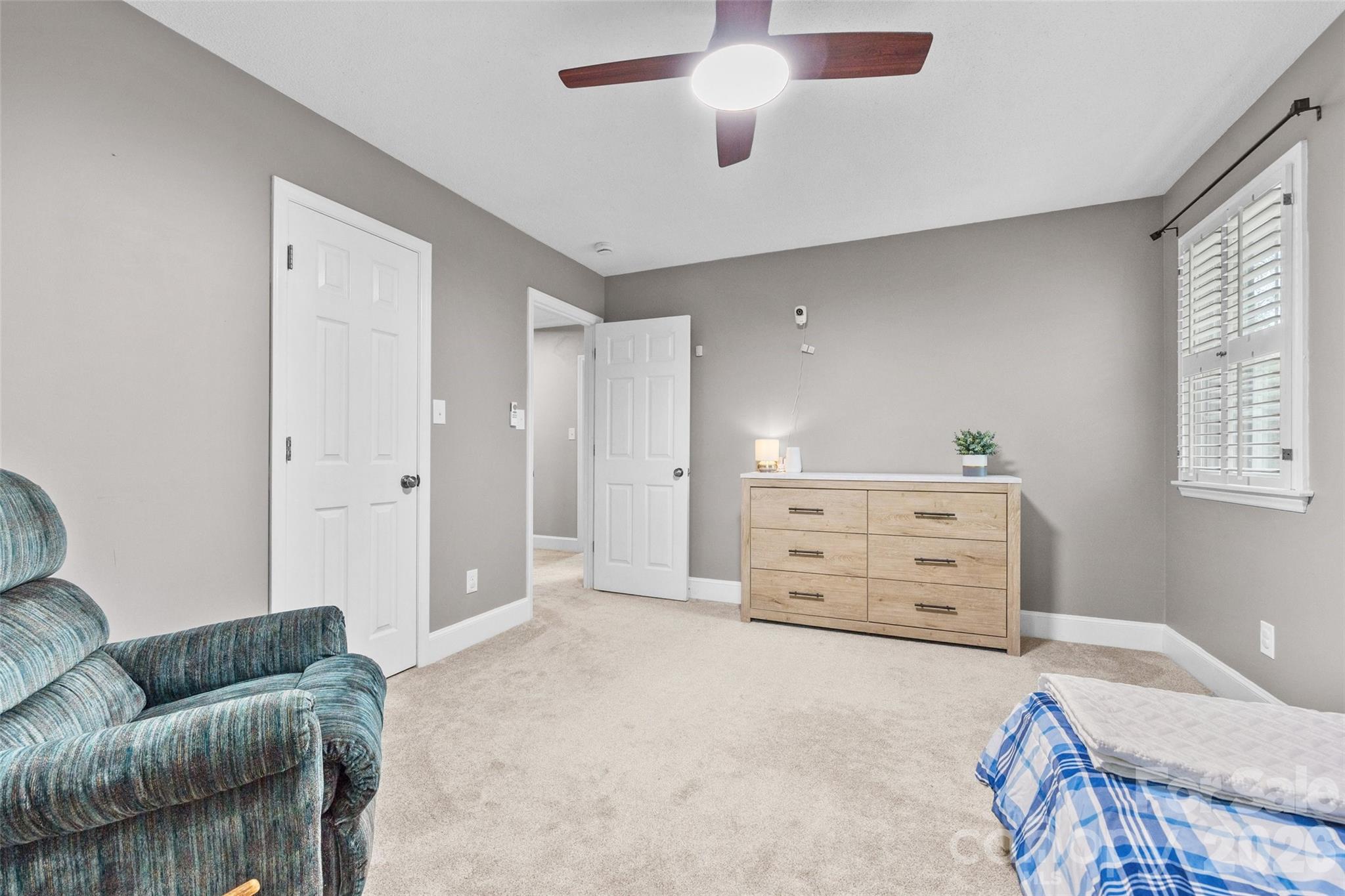 10500 Doylestown Road Matthews, NC 28105 - Photo 25 of 46 a bedroom with furniture and a couch