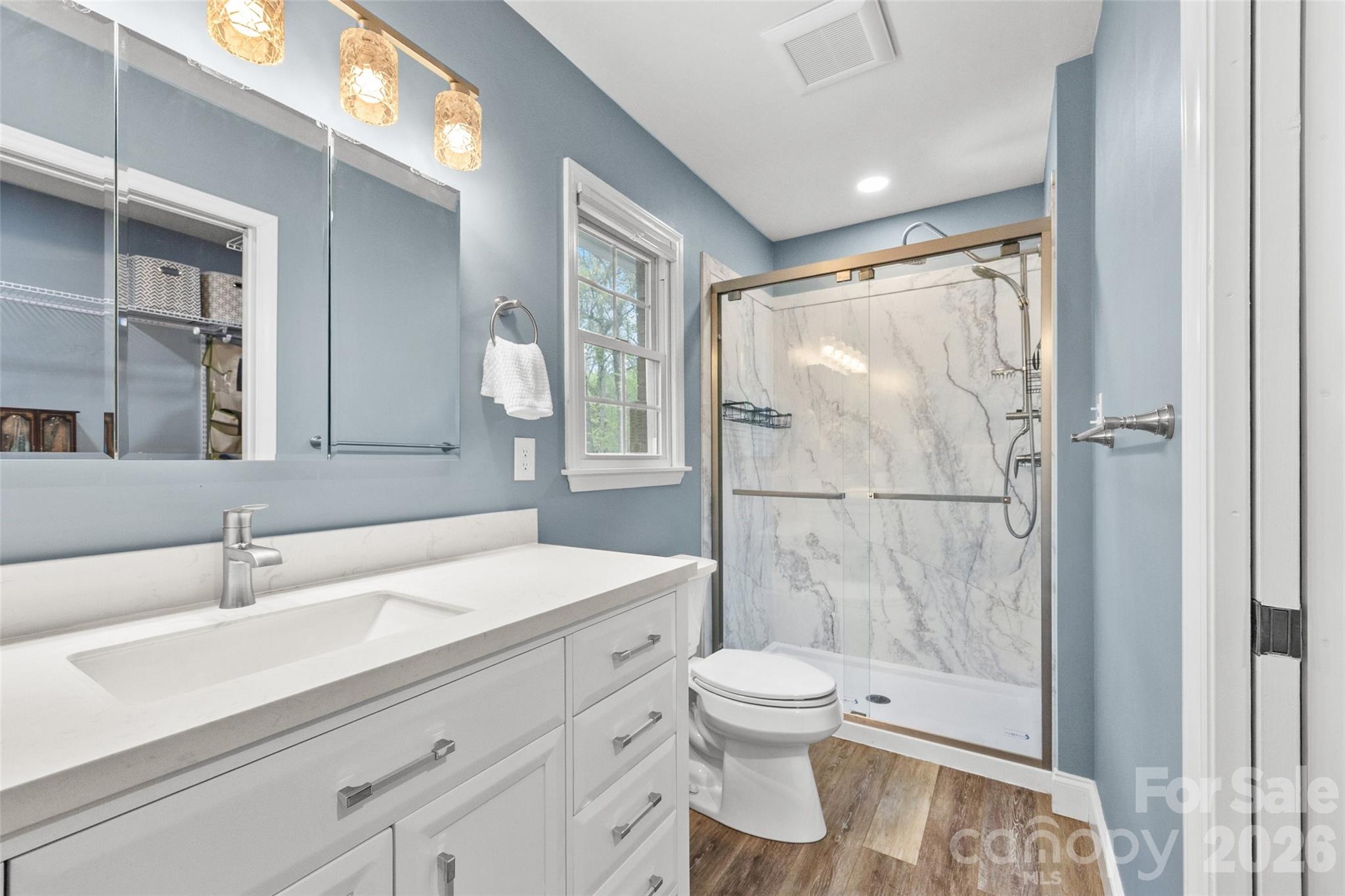 10500 Doylestown Road Matthews, NC 28105 - Photo 32 of 46 a bathroom with a sink toilet and shower
