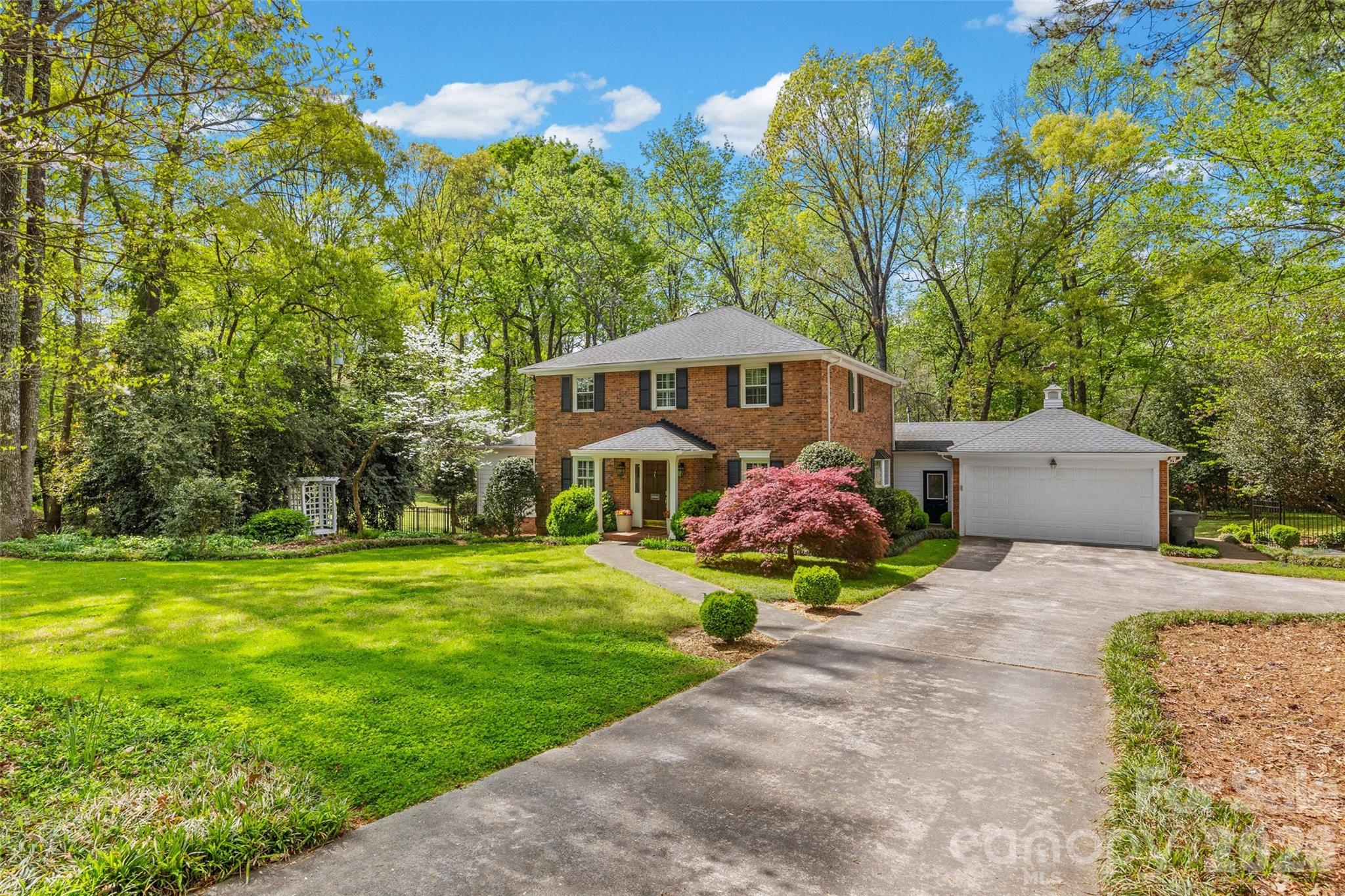 10500 Doylestown Road Matthews, NC 28105 - Photo 41 of 46 a front view of a house with garden