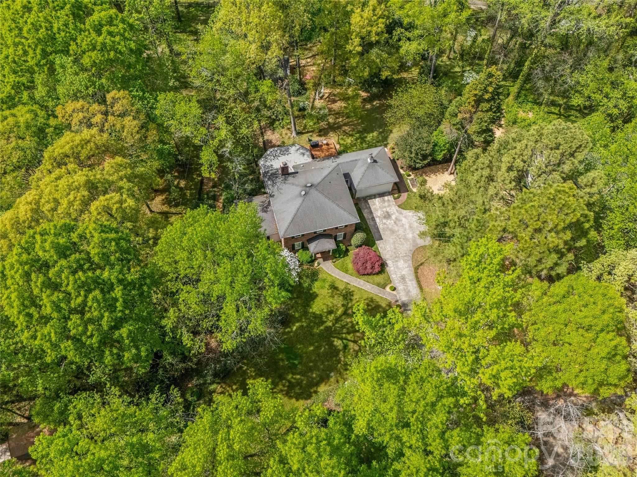 10500 Doylestown Road Matthews, NC 28105 - Photo 42 of 46 an aerial view of residential house with outdoor space and trees all around