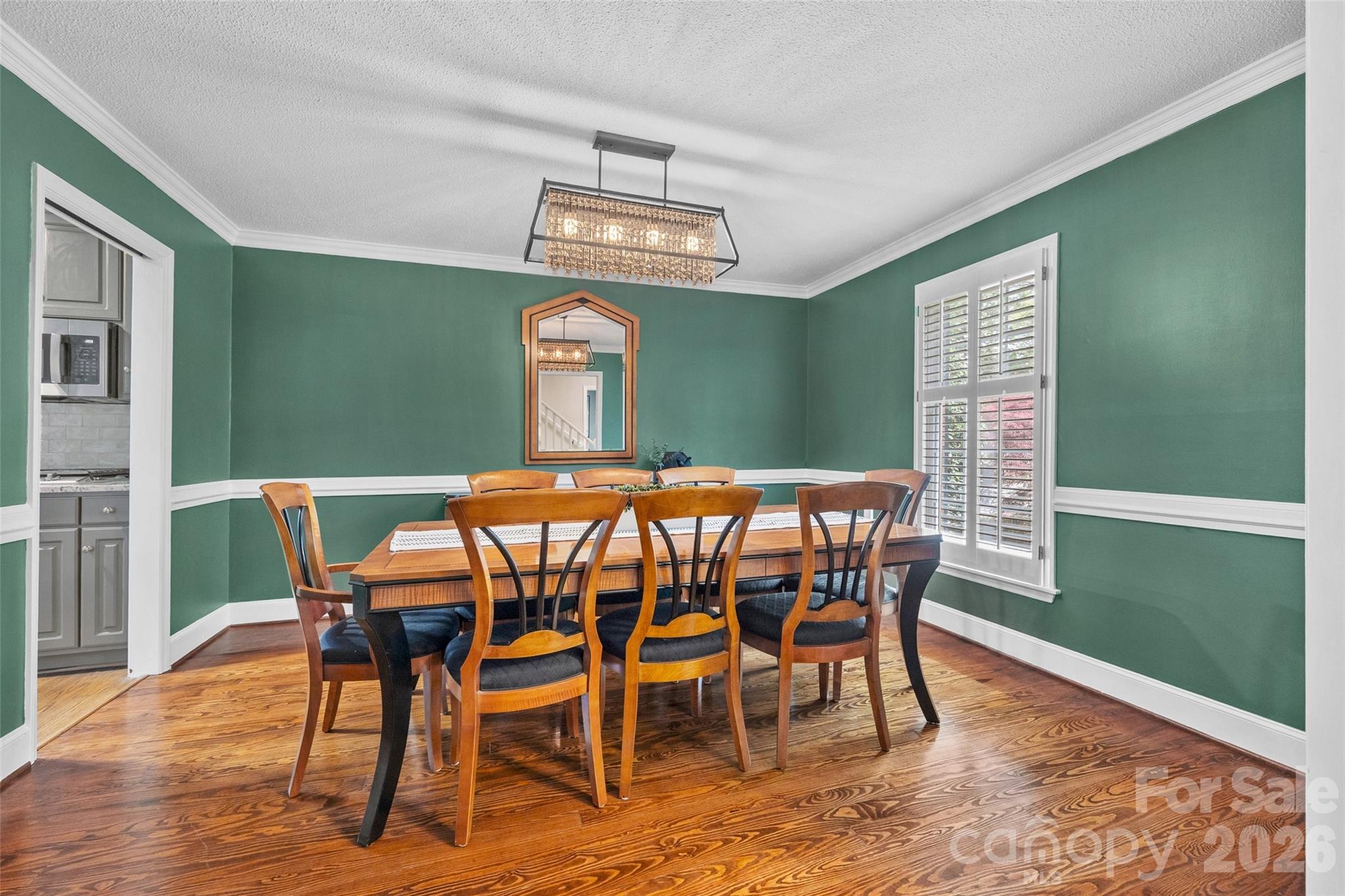 10500 Doylestown Road Matthews, NC 28105 - Photo 7 of 46 a view of a dining room with furniture window and wooden floor