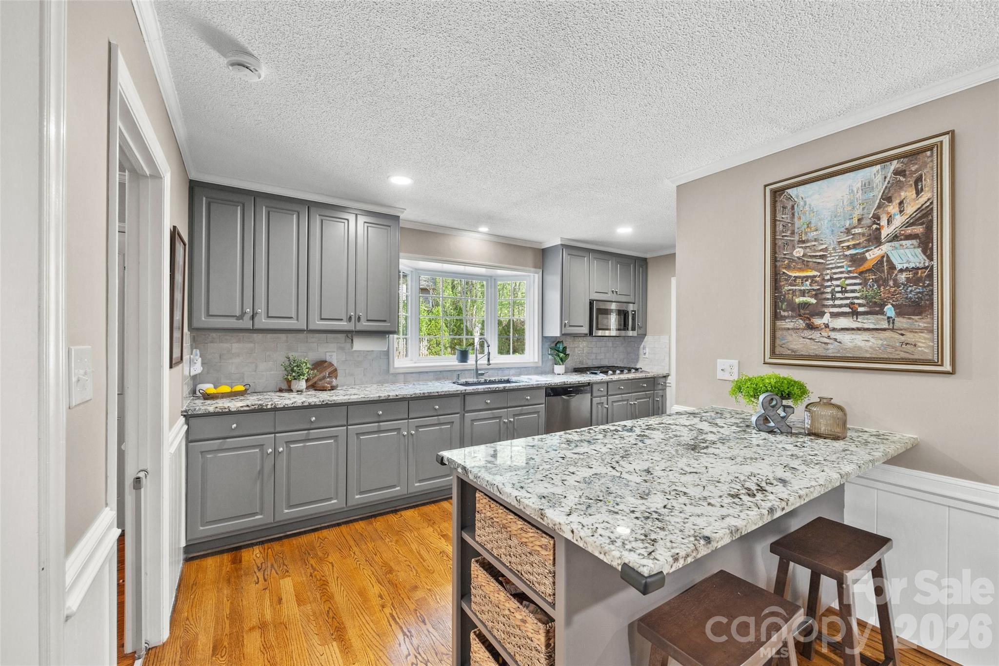 10500 Doylestown Road Matthews, NC 28105 - Photo 10 of 46 a kitchen with kitchen island granite countertop wooden cabinets a stove top oven a sink and dishwasher