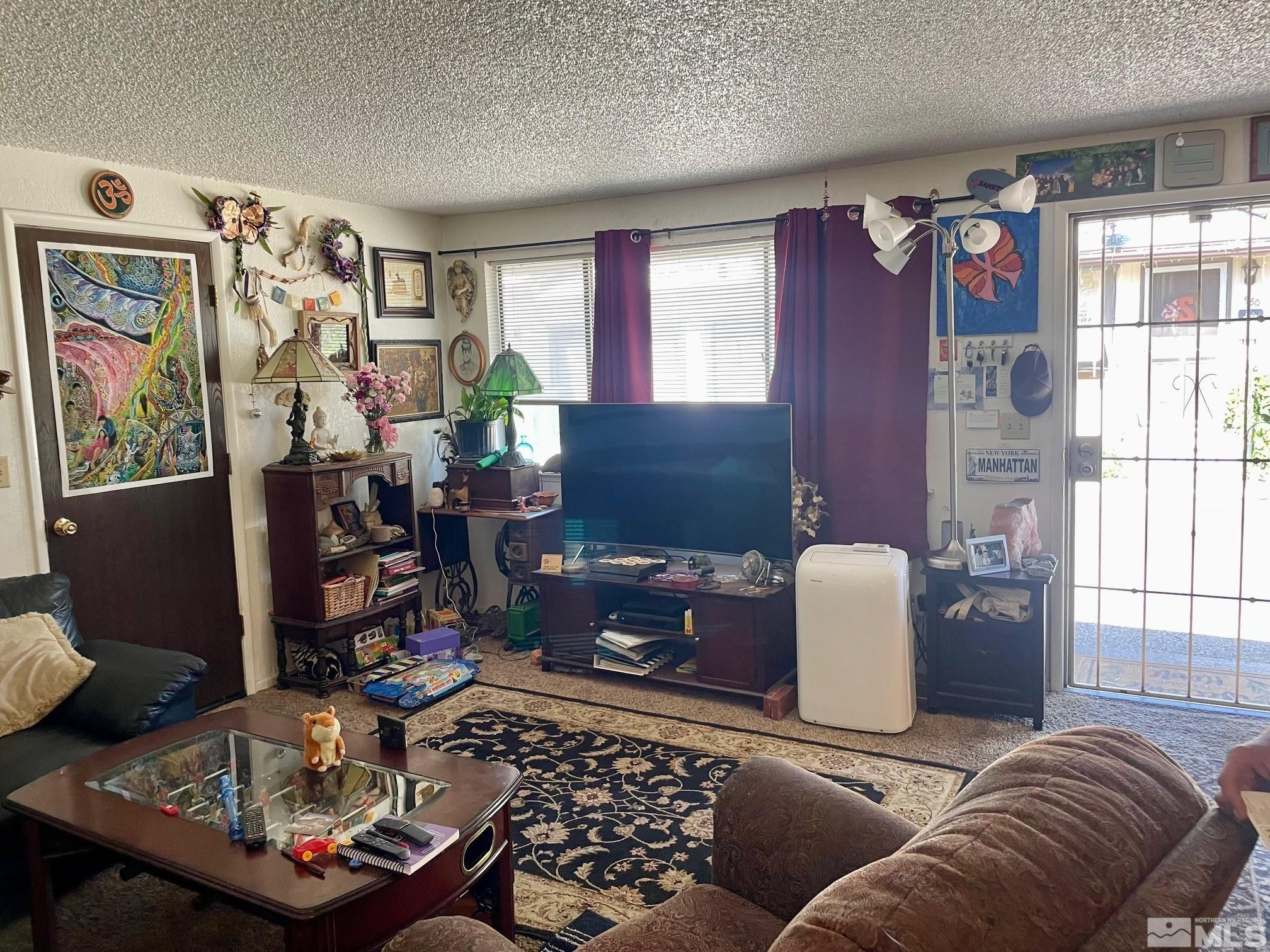 990-992 Roberts Street Reno, NV 89502 - Photo 4 of 19 a living room with furniture and a window