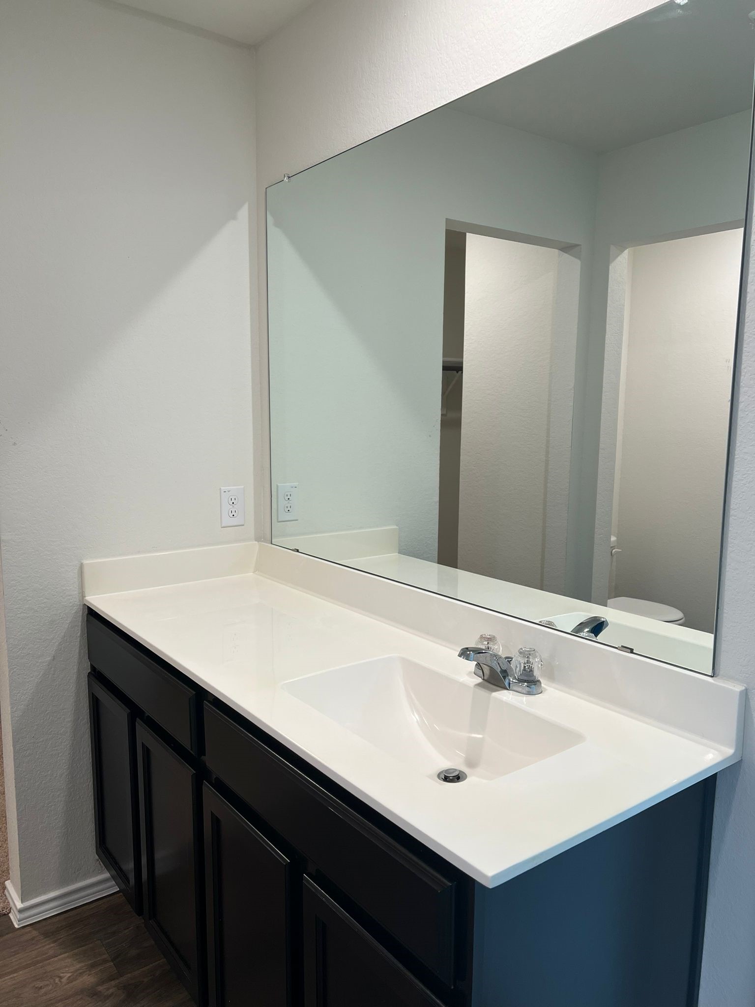 14901 Bajada Rd Manor Manor, TX 78653 - Photo 10 of 14 a bathroom with a sink and a mirror