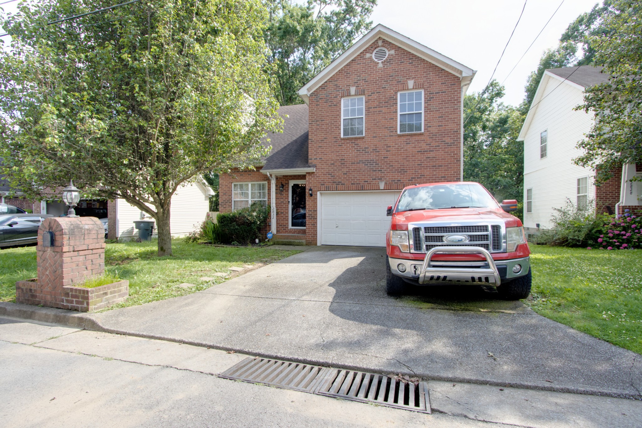 2832 Rader Ridge Court Antioch, TN 37013 - Photo 1 of 26 a car parked in front of a house with a yard