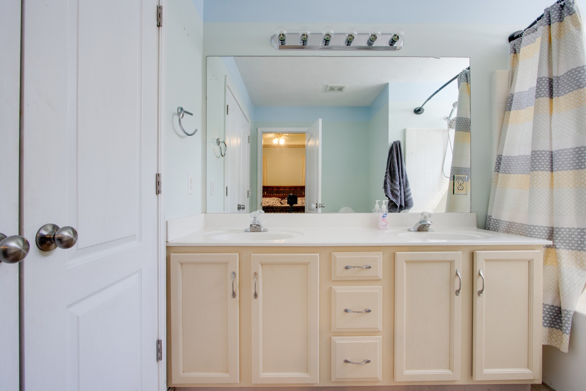 2832 Rader Ridge Court Antioch, TN 37013 - Photo 22 of 26 a bathroom with a sink vanity and a mirror