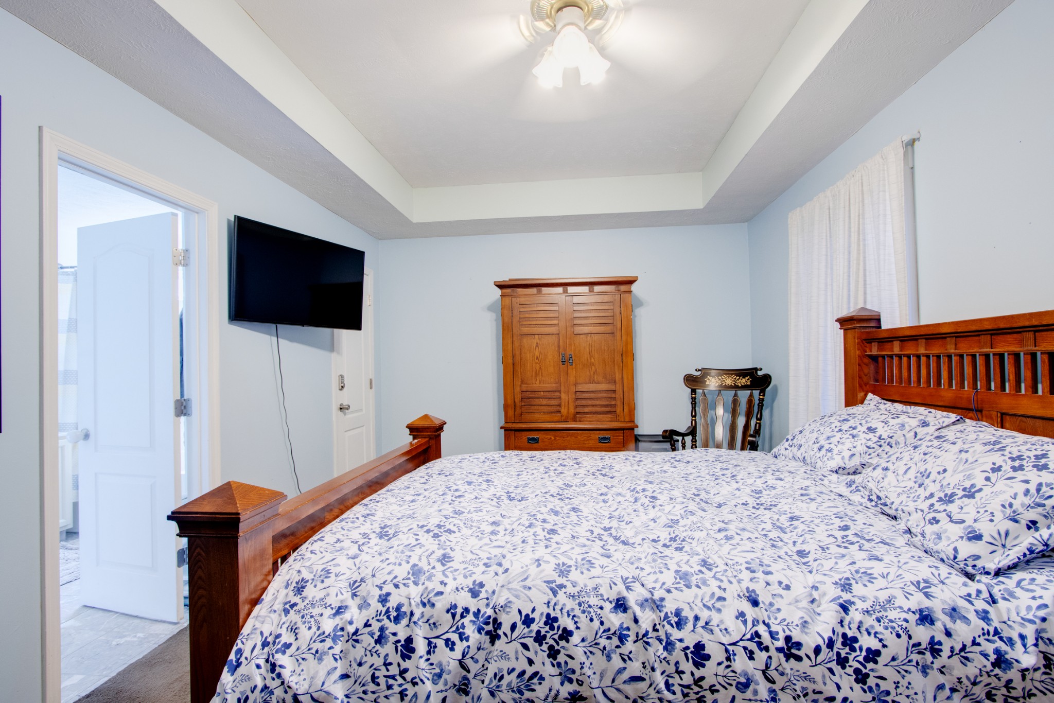 2832 Rader Ridge Court Antioch, TN 37013 - Photo 24 of 26 a bedroom with a bed and a flat screen tv
