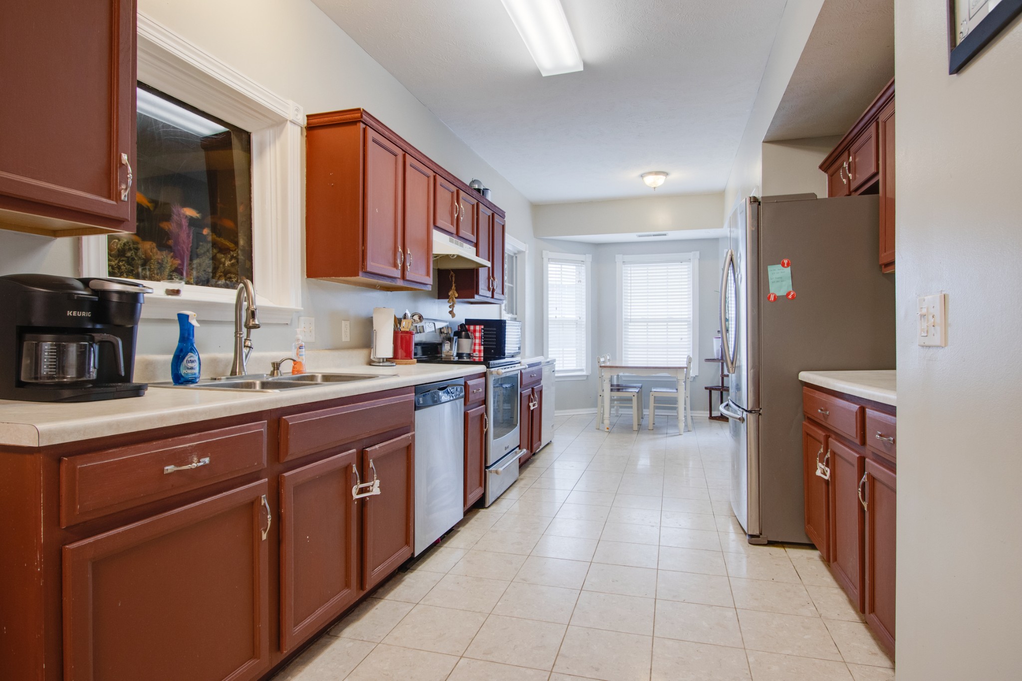 2832 Rader Ridge Court Antioch, TN 37013 - Photo 8 of 26 a kitchen with stainless steel appliances a sink counter top space cabinets and a window
