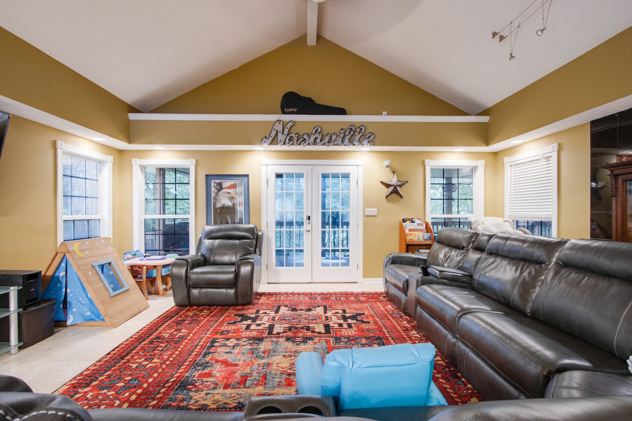2832 Rader Ridge Court Antioch, TN 37013 - Photo 10 of 26 a living room with furniture ceiling fan and a rug