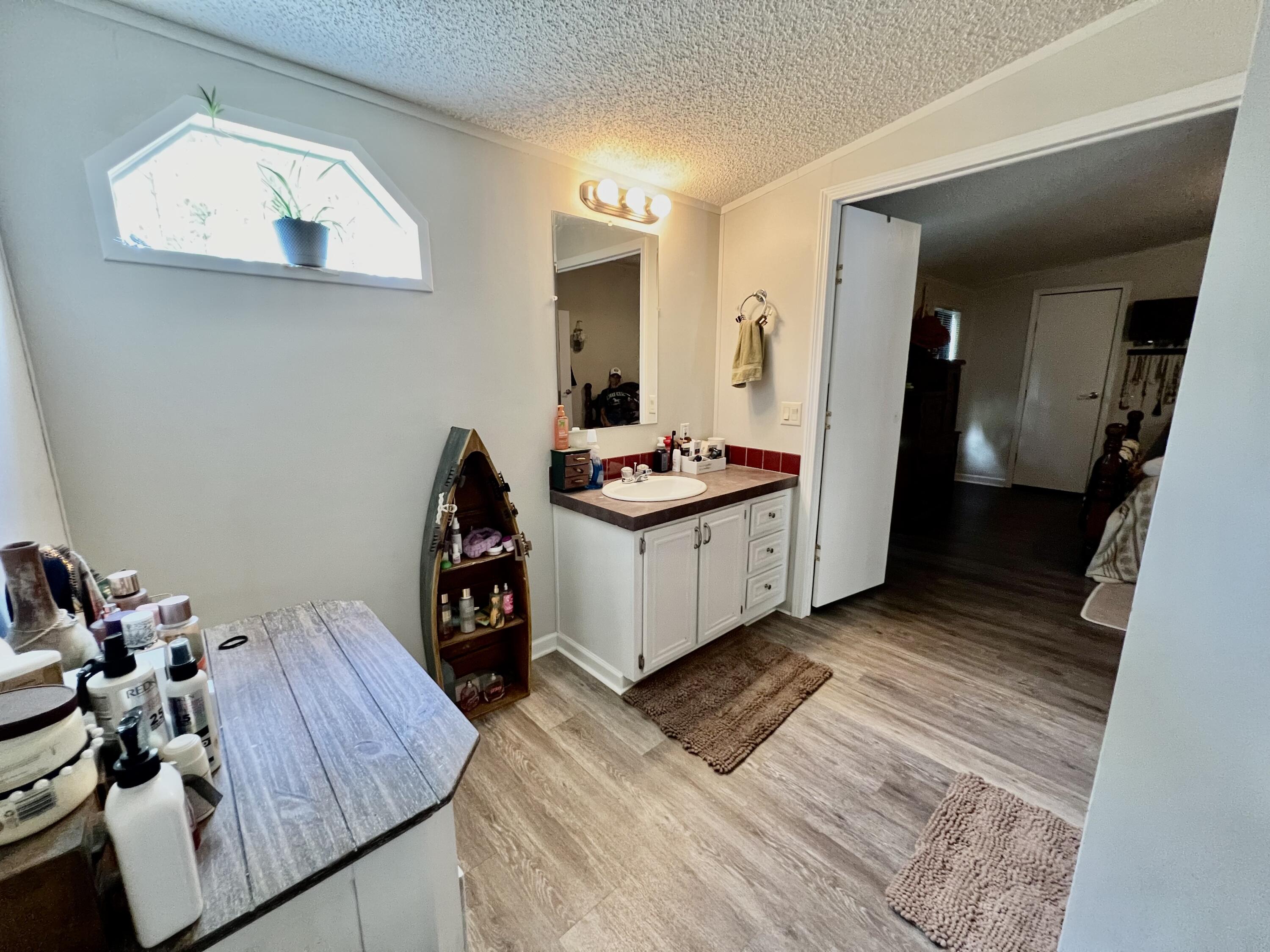 403 Don Graff Road Freeport, FL 32439 - Photo 11 of 34 a living room with furniture and a wooden floor