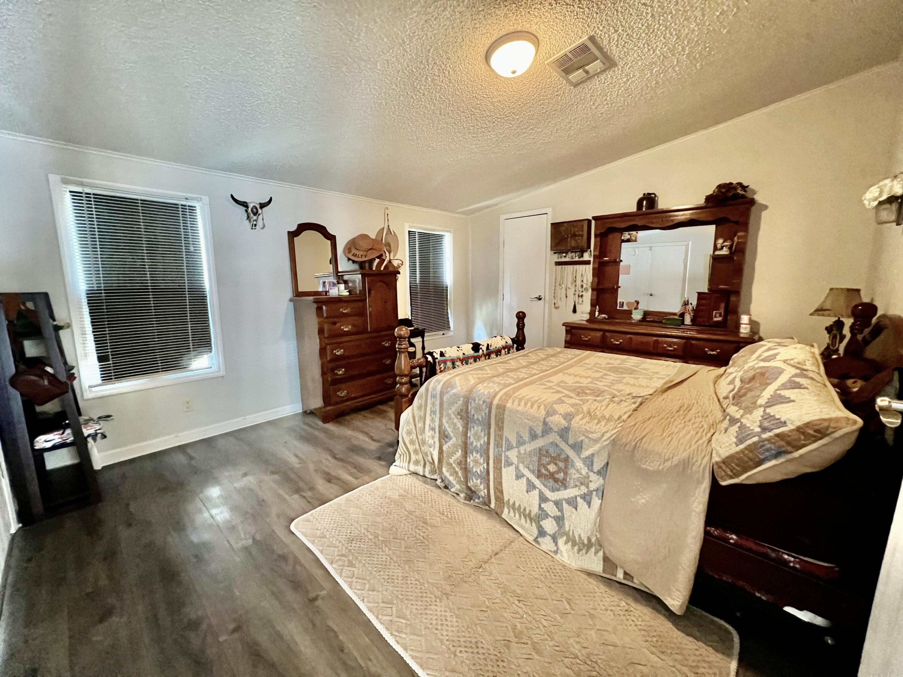 403 Don Graff Road Freeport, FL 32439 - Photo 7 of 34 a bed sitting in a spacious bedroom next to a window
