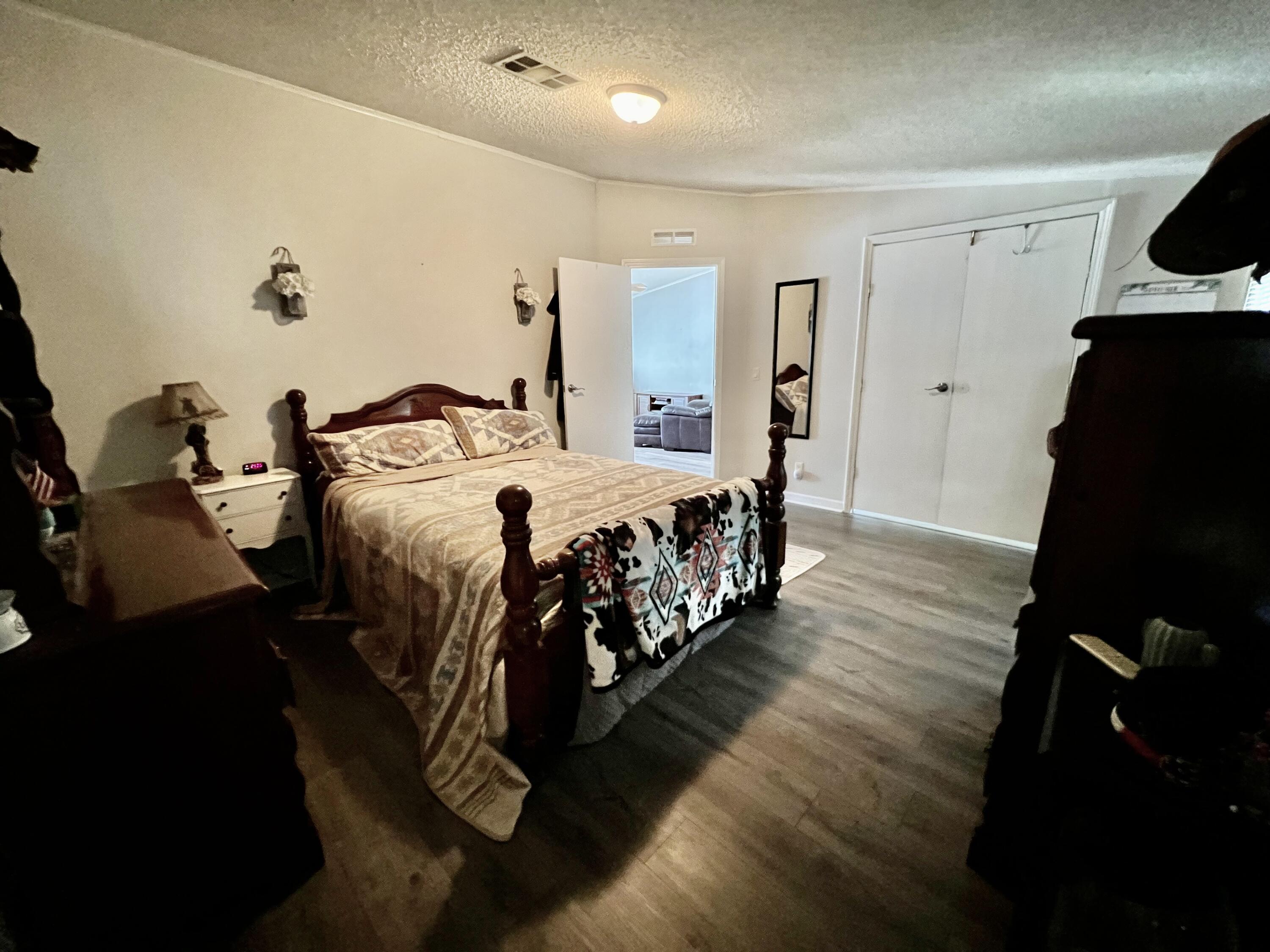 403 Don Graff Road Freeport, FL 32439 - Photo 8 of 34 a bed room with a bed and dresser