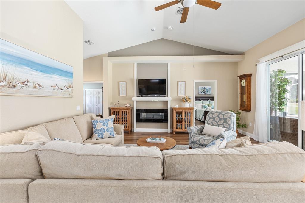 19639 Southwest 77th Loop Dunnellon, FL 34432 - Photo 21 of 59 a living room with furniture a fireplace and a flat screen tv