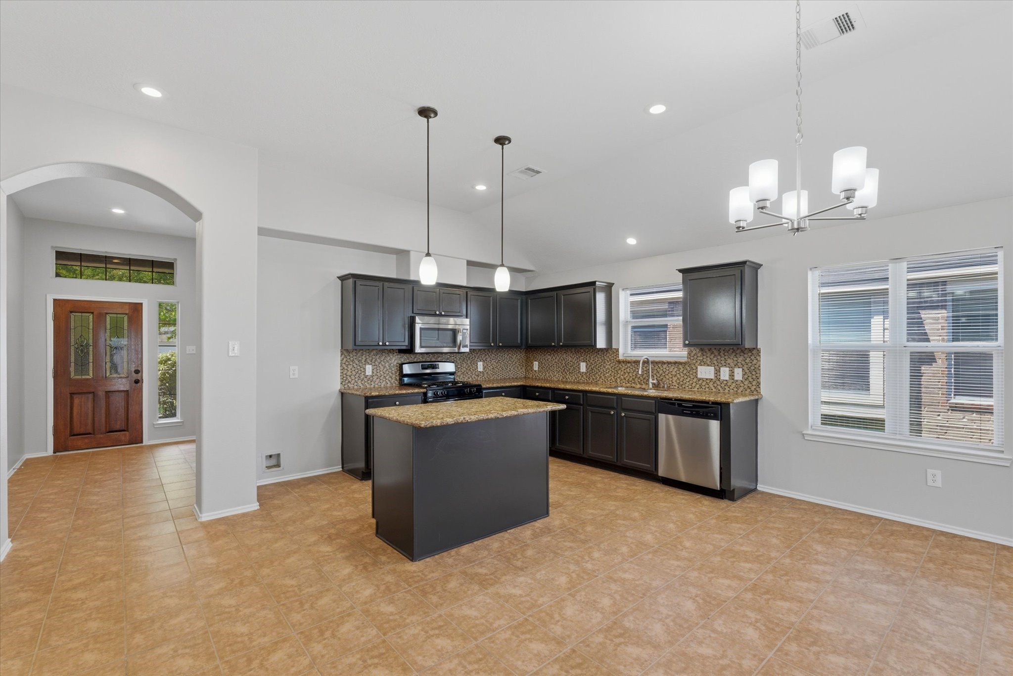 4506 Prince Street Baytown, TX 77521 - Photo 4 of 26 Kitchen with new stove and dishwasher!