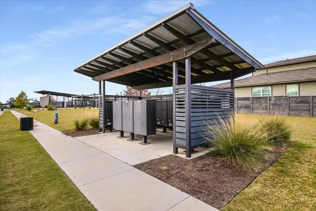 a view of a backyard with a tree