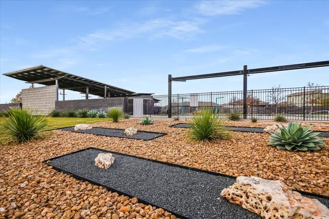 a view of a swimming pool with a lounge chair