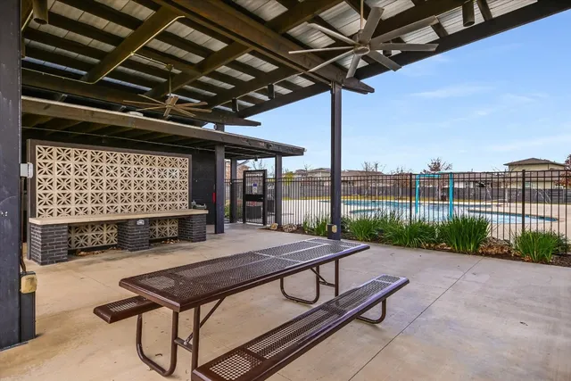 a view of a backyard with sitting area
