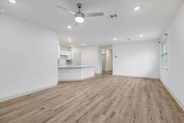 a view of kitchen with wooden floor and sink