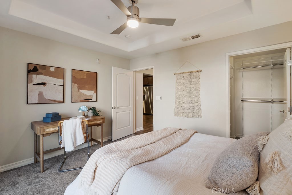629 Traction Avenue, Unit 312 Los Angeles, CA 90013 - Photo 18 of 45 a bedroom with a bed and a chandelier