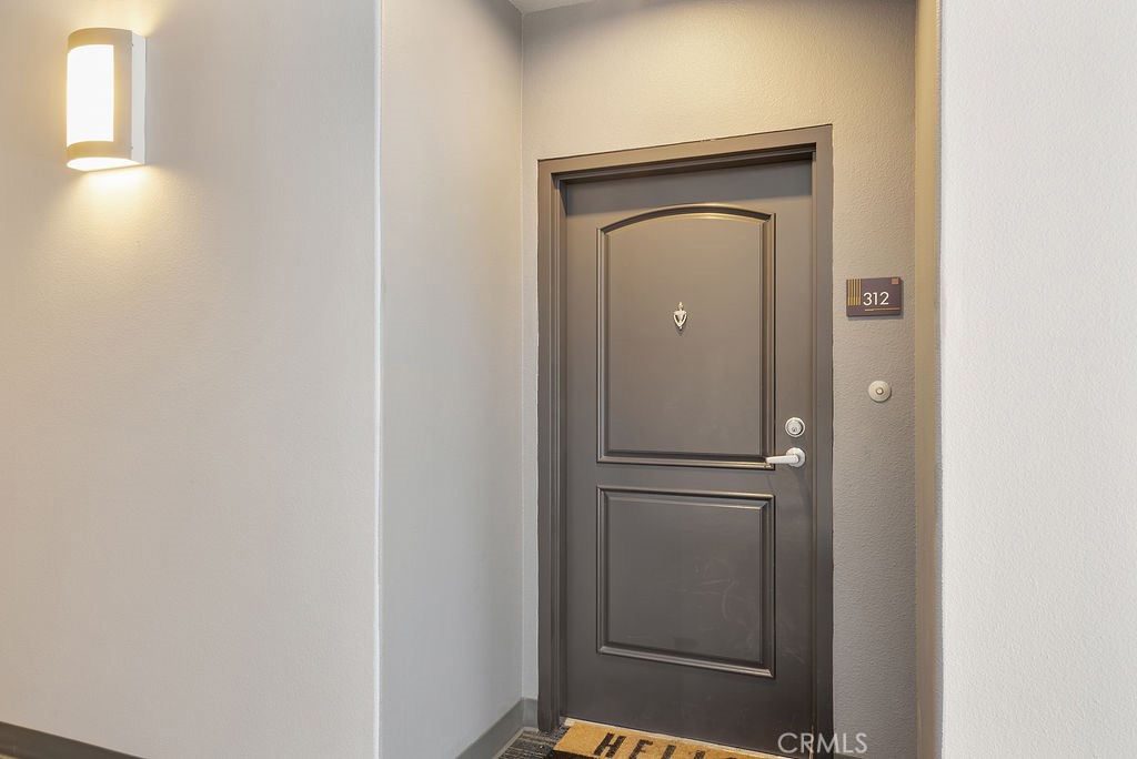 629 Traction Avenue, Unit 312 Los Angeles, CA 90013 - Photo 21 of 45 a view of a hallway with wooden floor