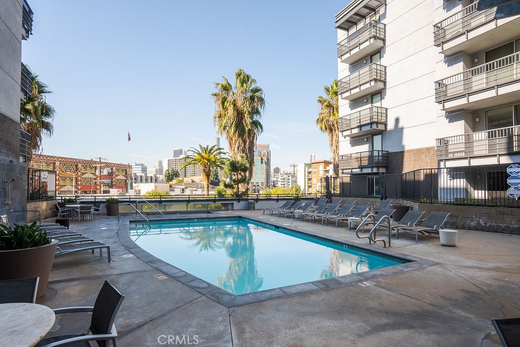 629 Traction Avenue, Unit 312 Los Angeles, CA 90013 - Photo 27 of 45 a view of a swimming pool with outdoor seating and plants