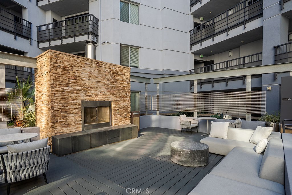 629 Traction Avenue, Unit 312 Los Angeles, CA 90013 - Photo 31 of 45 a living room with furniture and a fireplace