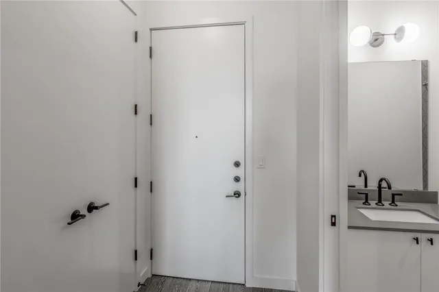 a bathroom with a sink and shower