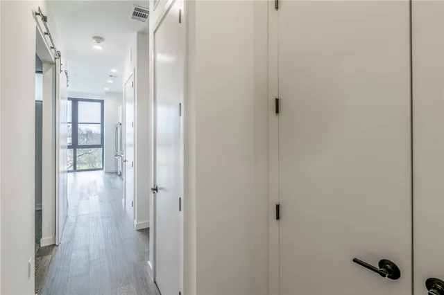 a view of a bathroom from a hallway