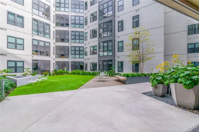 a view of an apartment with a garden