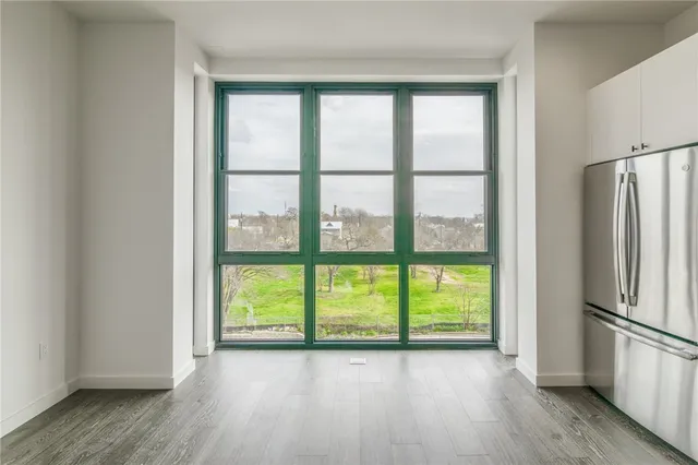 a view of a kitchen with a large window