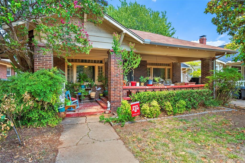 2218 Mistletoe Boulevard Fort Worth, TX 76110 - Photo 1 of 1 front view of a house with a yard