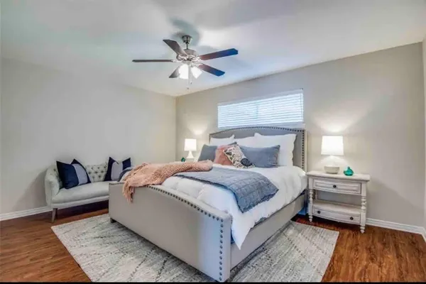 a bedroom with a bed and a couch