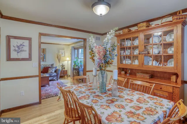 a dining room with a table and chairs